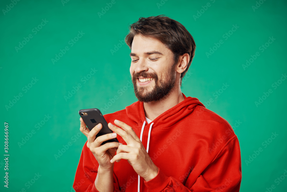 portrait of young man with cup of coffee in hand