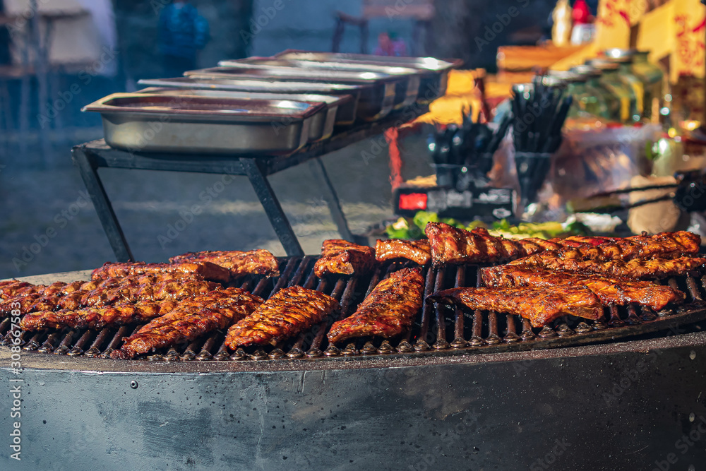 Culinary Buffet with healthy take away meal - grilled vegetables, fish and meat on the street food culinary market, festival, event.  Different types of delicious meat. Outdoor Cuisine.