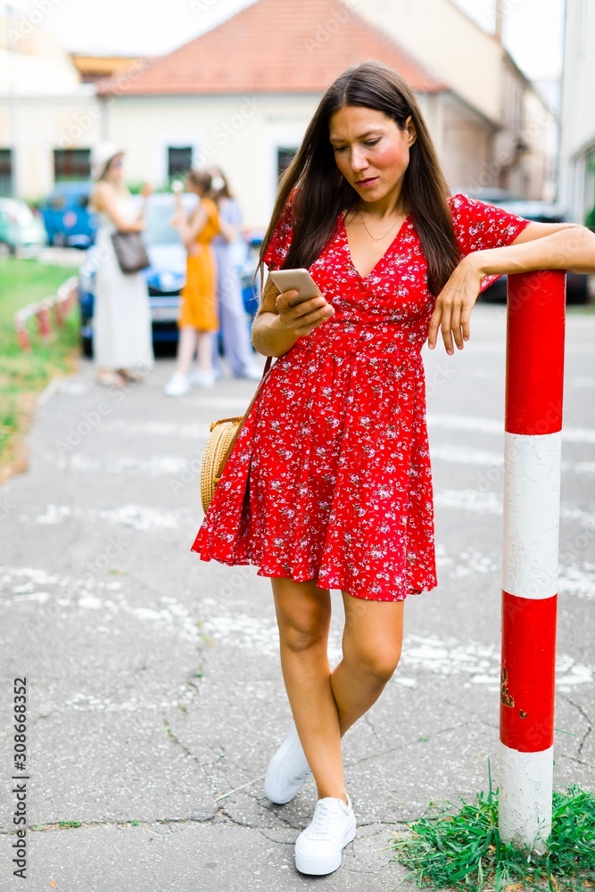 Young woman checking her smart phone