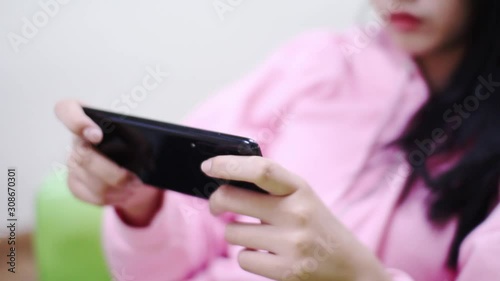 play game,young woman using mobile phone, Game stream,Portrait of teenage gamer boy playing video games on smartphone 