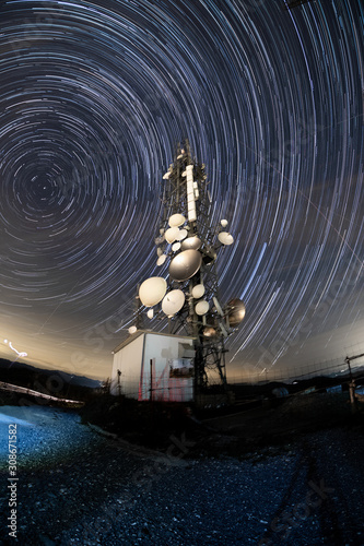 Startrail of an Antenna above a mountain above Genoa, Italy