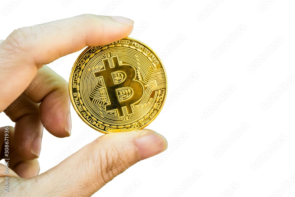 closeup of Digital currency physical golden bitcoin on woman hand isolated on white background. closeup of Digital currency physical golden bitcoin on woman hand isolated on white background.