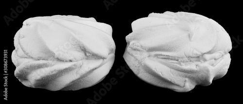 Sweet white marshmallows isolated on a black background close-up. Macro, full focus.