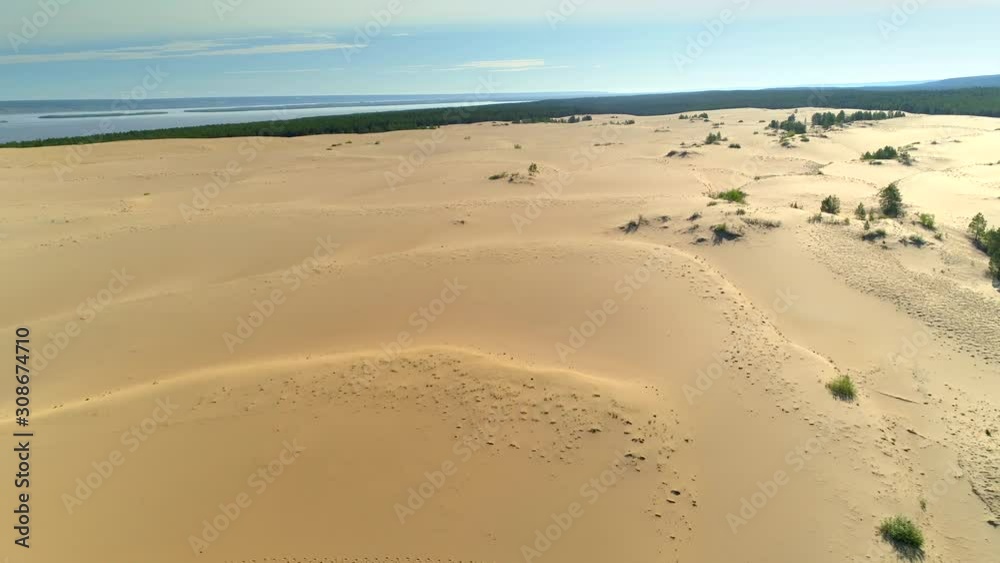 Aerial desert shallow sandbank coastal relief Lena river close up sand waves natural landscape cinematic unique Russia Yakutsk Siberia sight. Forest untouched wild taiga. Summer open space horizon Aerial desert shallow sandbank coastal relief Lena river close up sand waves natural landscape cinematic unique Russia Yakutsk Siberia sight. Forest untouched wild taiga. Summer open space horizon