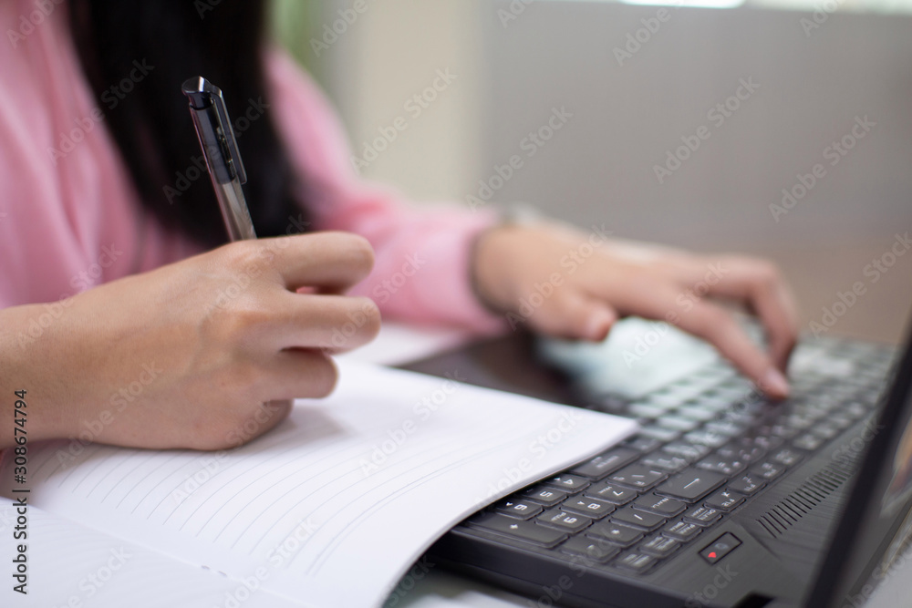 Fototapeta premium closeup of hand typing on laptop keyboard