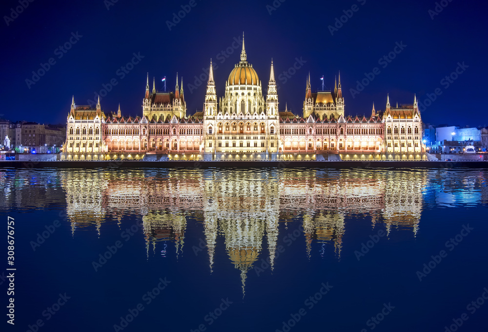 Hungarian Parliament at night with reflection in Danube river, Budapest, Hungary