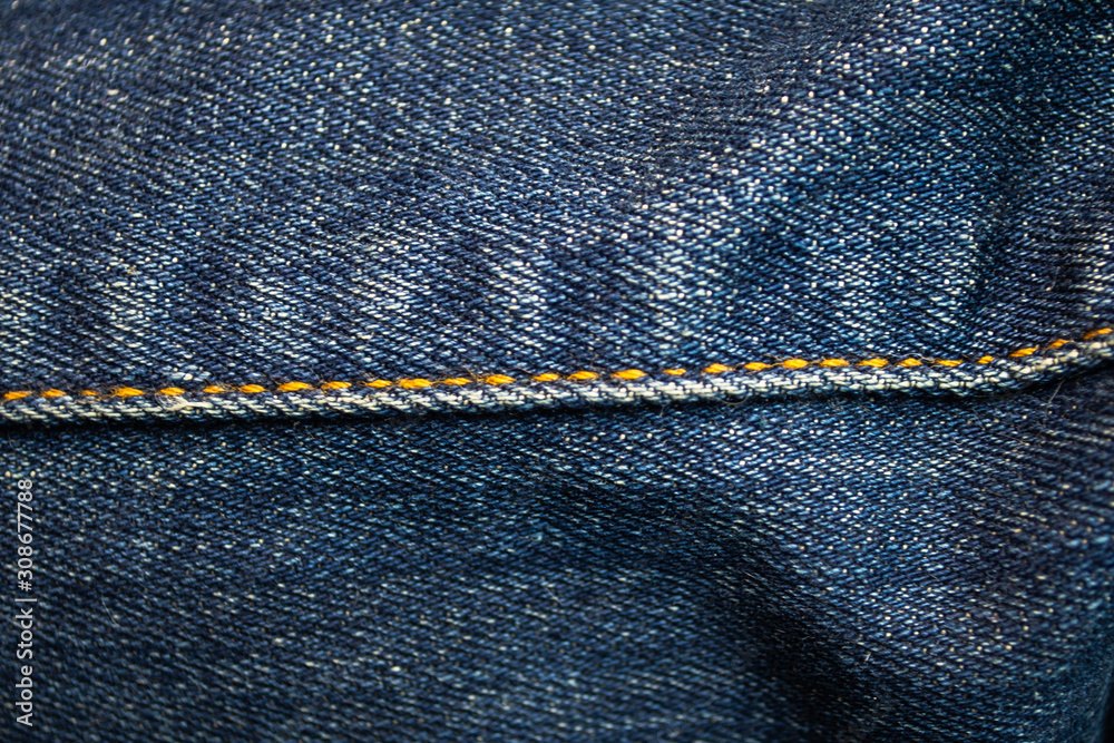Denim jeans texture, denim jeans background with a seam. Denim jeans texture, denim jeans background with a seam.