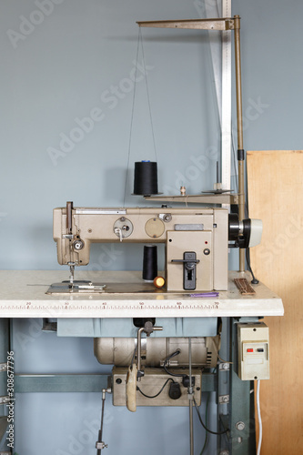 Industrial sewing machine. Handmade concept. Concept of small business to create leather products. photo