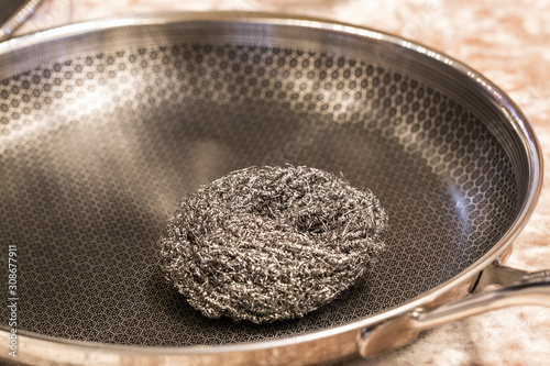 Konstfotografi stainless steel scrubber, scouring pad for dish washing on flying fan