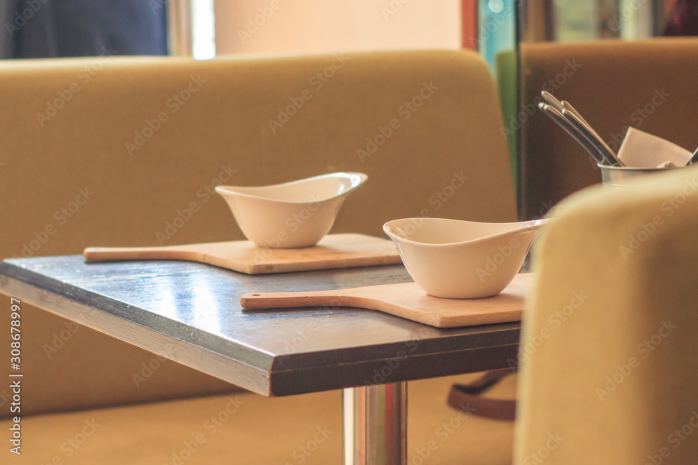 Retro style dining room interior details. White plate on the table
