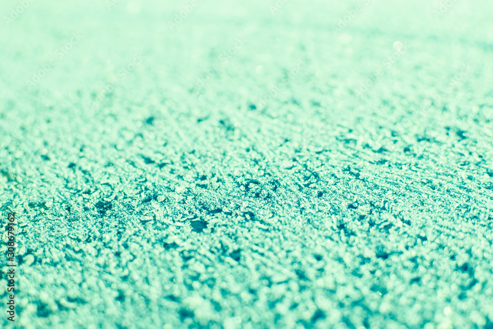 Obraz premium Green snowy surface.