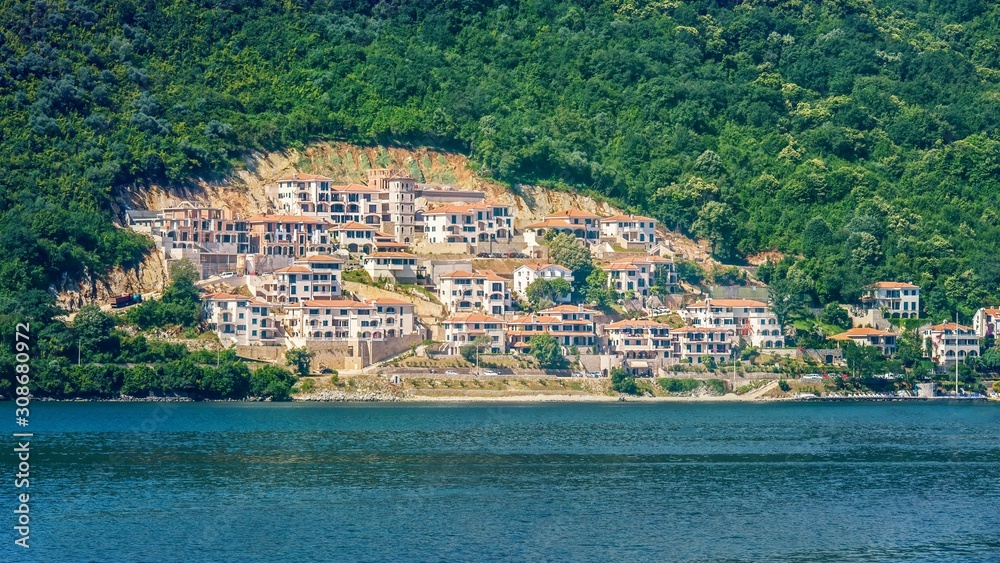 A new housing development is cut out of forest land on the side of a hill in Montenegro.