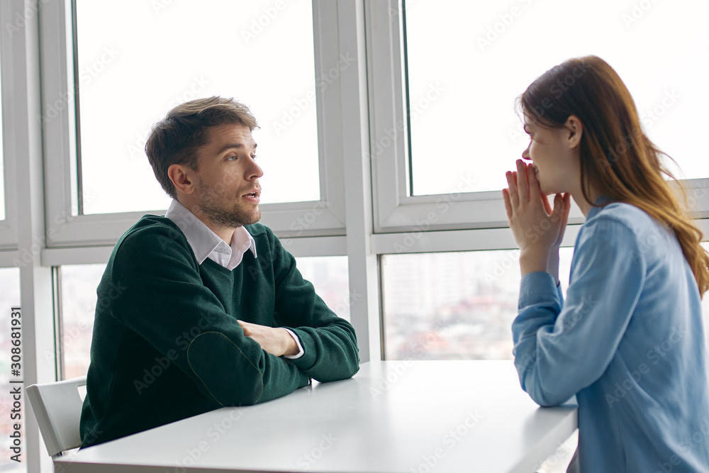 man and woman shaking hands in office man and woman shaking hands in office