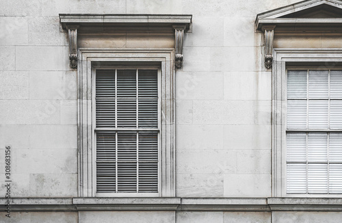 Large old fashioned European style neoclassical windows shot straight on. © Stephen