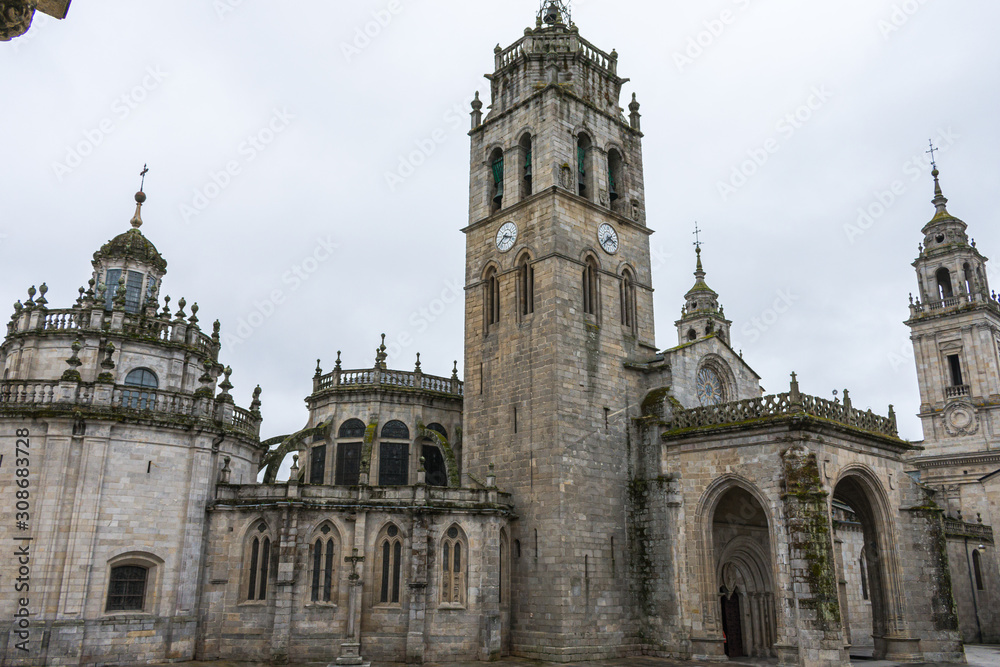 Lugo cathedral church with tower on cloudy day