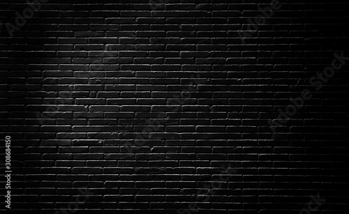 Abstract black brick wall texture background for interior decoration.