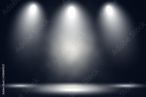 White stage with spot lighting and fog in black background. 