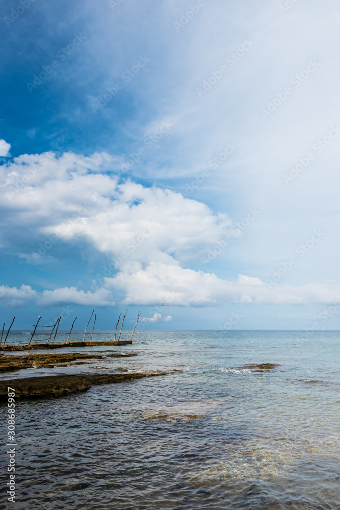 The small dock with the typical wooden cranes of Savudrija, Croatia The small dock with the typical wooden cranes of Savudrija, Croatia
