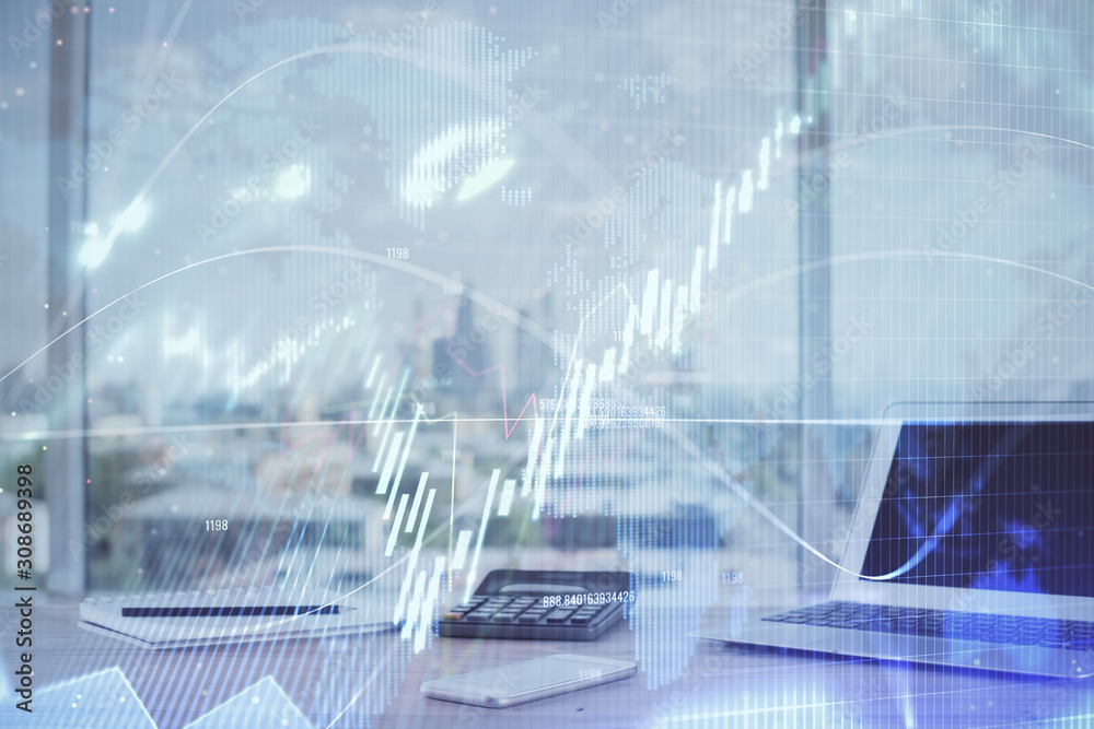 Forex Chart hologram on table with computer background. Multi exposure. Concept of financial markets. Forex Chart hologram on table with computer background. Multi exposure. Concept of financial markets.