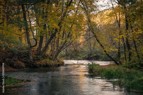 Swider river in autumn near the old weir nearby Kolbiel, Masovia, Poland