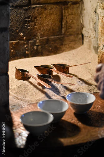 Turkish coffee prepared on hot sand in a furnace