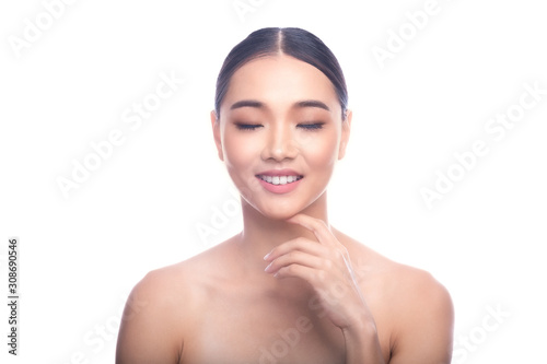 Beautiful Young Asian Woman with Clean Fresh Skin isolate on white background. Spa, Face care, Facial treatment, Beauty and Cosmetics concept. Thinking face. Eye close, big smile.