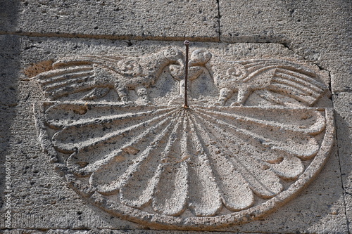 Sundial on the wall of a medieval church in Armenia