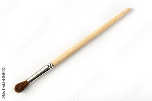 Brush with wooden handle on white background, isolated