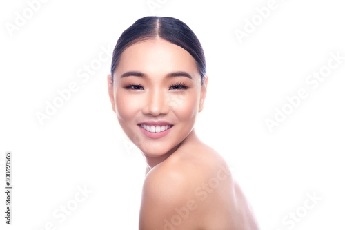 Beautiful Young Asian Woman with Clean Fresh Skin isolate on white background. Spa, Face care, Facial treatment, Beauty and Cosmetics concept. Chin on shoulder, big smile