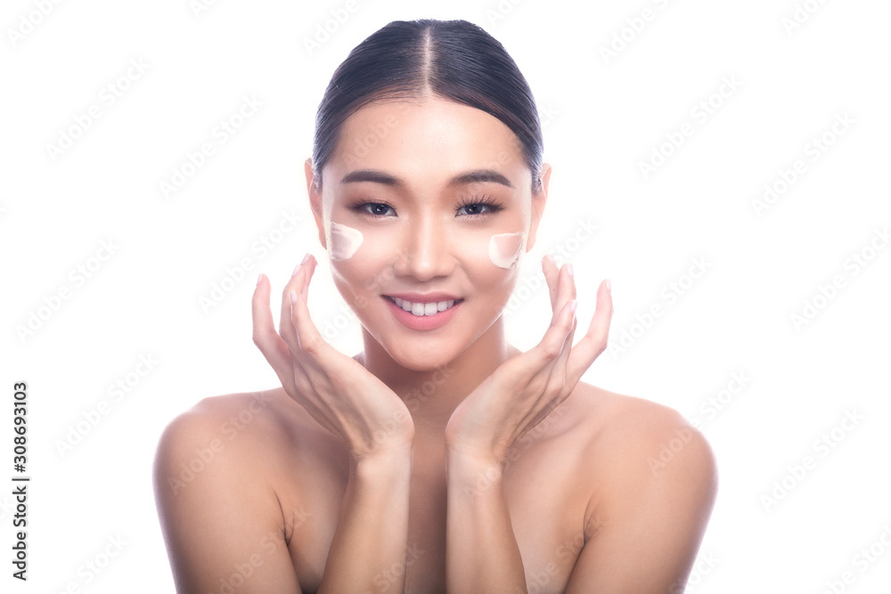 Beautiful Young Asian Woman with Clean Fresh Skin isolate on white background. Spa, Face care, Facial treatment, Beauty and Cosmetics concept. Cream on face, v shape hand, big smile. Beautiful Young Asian Woman with Clean Fresh Skin isolate on white background. Spa, Face care, Facial treatment, Beauty and Cosmetics concept. Cream on face, v shape hand, big smile.