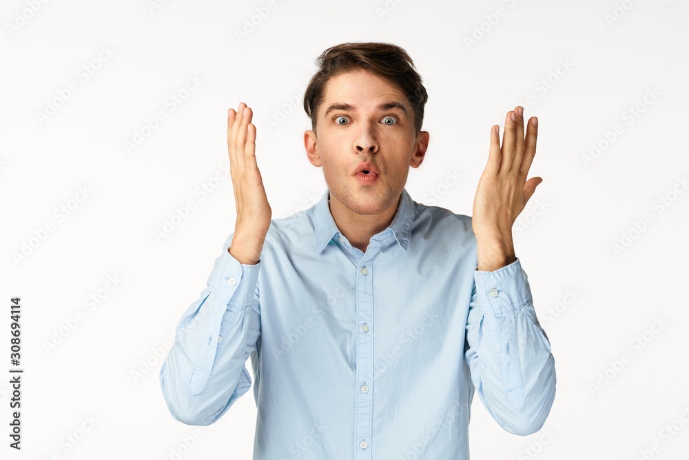 young man with hands on his head young man with hands on his head
