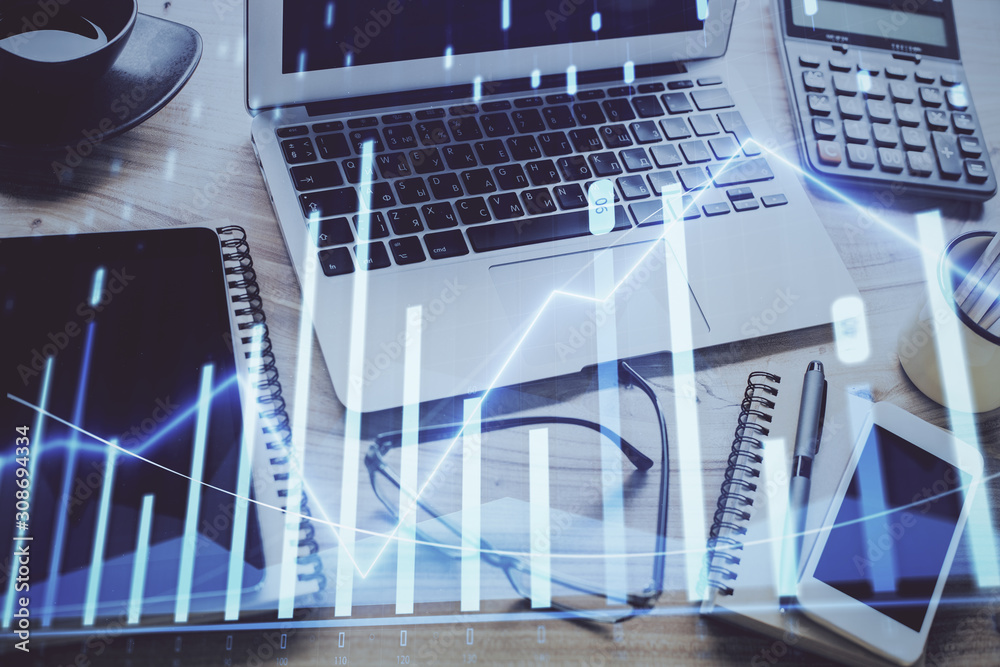 Stock market graph and table with computer background. Double exposure. Concept of financial analysis. Stock market graph and table with computer background. Double exposure. Concept of financial analysis.