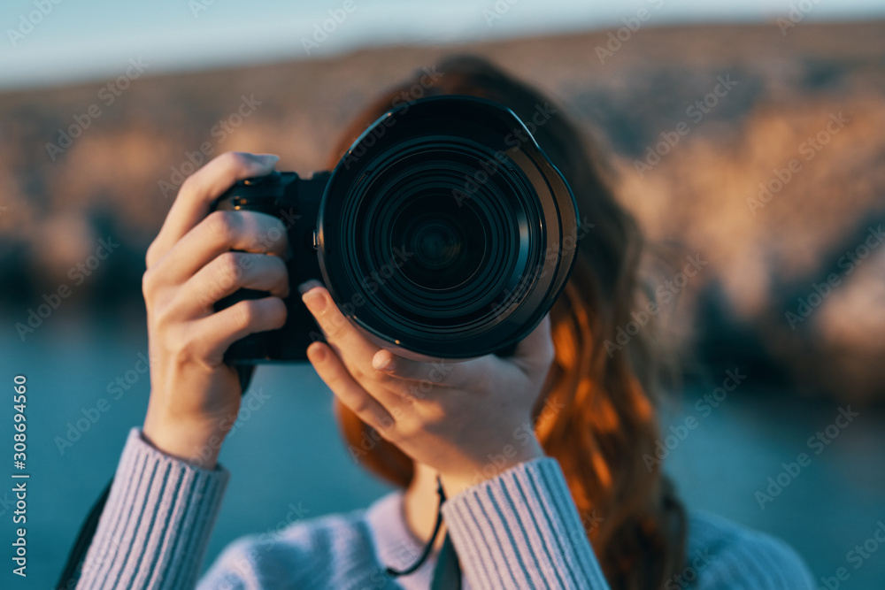 woman taking photo with digital camera woman taking photo with digital camera
