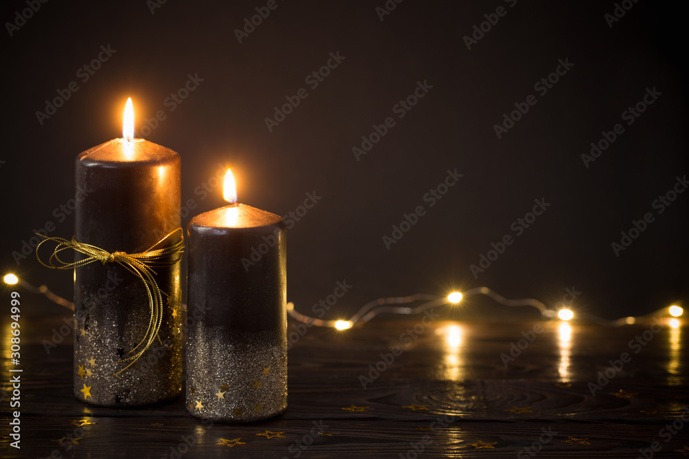 black Christmas candles on dark background