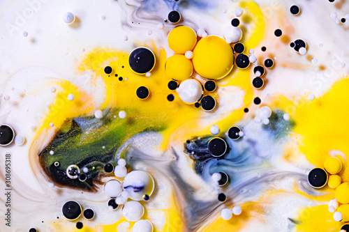 Alcohol ink mixing raster background. White fluid with black and yellow color bubbles illustration. Abstract contemporary art. Acrylic, oil paint flow with blue sparkling glitter backdrop.