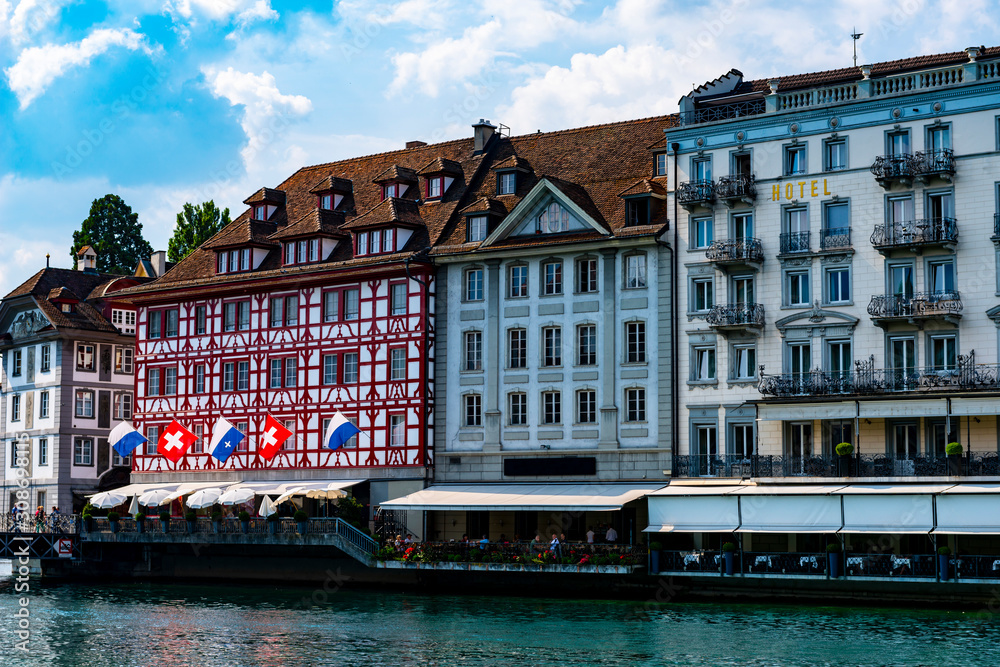 Naklejka premium Reuss River and City of Lucerne with Luxury Hotel in Switzerland.