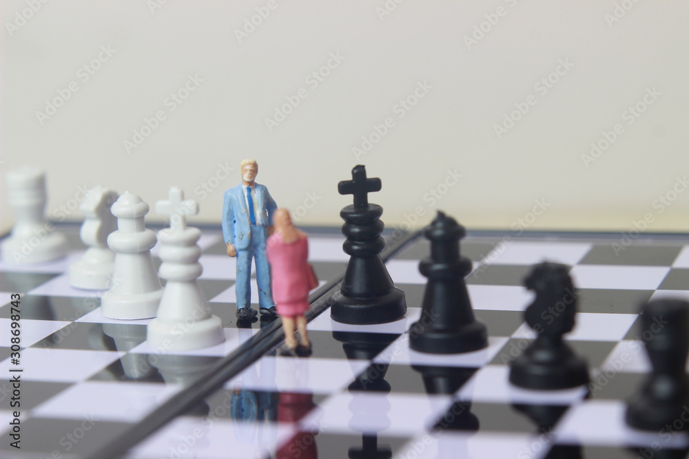 Simple illustration for photo War, Battle or politic situation concept, 2 standing mini figure, man and woman negoitation or debate beyond Small Magnetic Plastic chess Simple illustration for photo War, Battle or politic situation concept, 2 standing mini figure, man and woman negoitation or debate beyond Small Magnetic Plastic chess