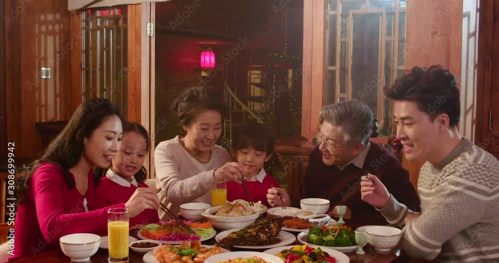 Happy family eating dinner for Chinese New Year,4K