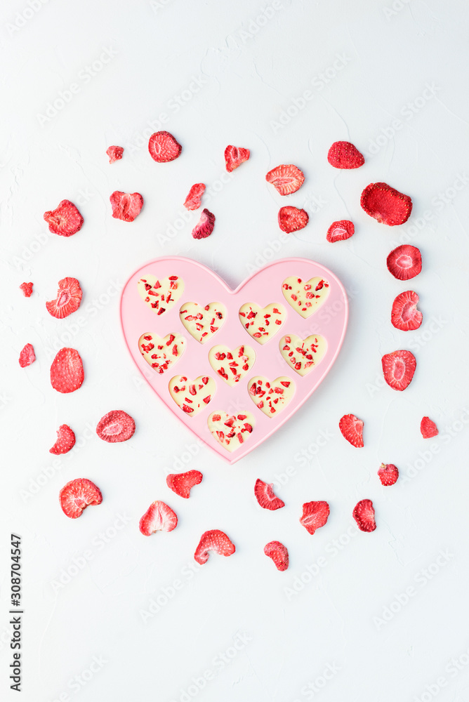 Heart candy made of white chocolate and dried strawberries. Valentine's Day.