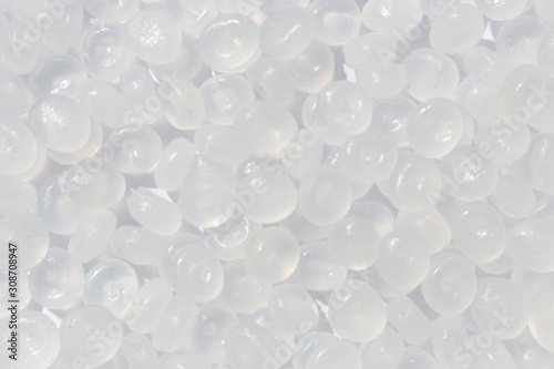 Close-up of plastic polymer granules. hand hold Polymer pellets. polymer plastic. compound polymer.