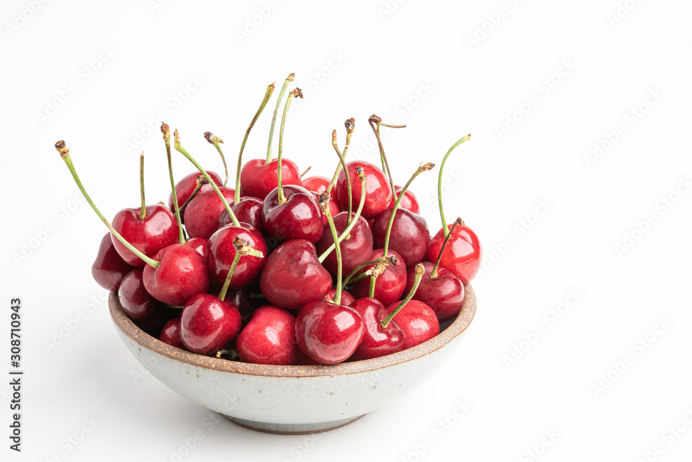 Fresh Red Cherries In A Small Round Stoneware Bowl Fresh Red Cherries In A Small Round Stoneware Bowl