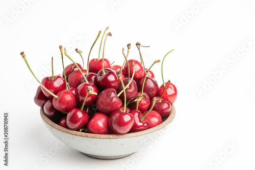 Fresh Red Cherries In A Small Round Stoneware Bowl