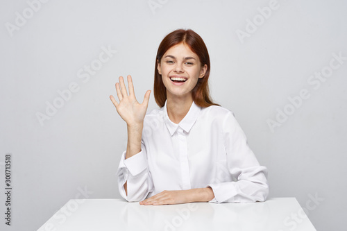 portrait of a young woman sitting at her desk