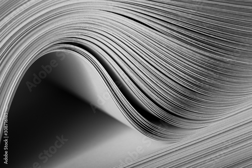 Close-up of a bending stack of paper photo