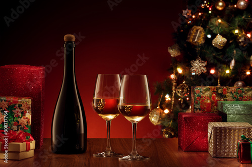close up view of champagne with gifts on  color back