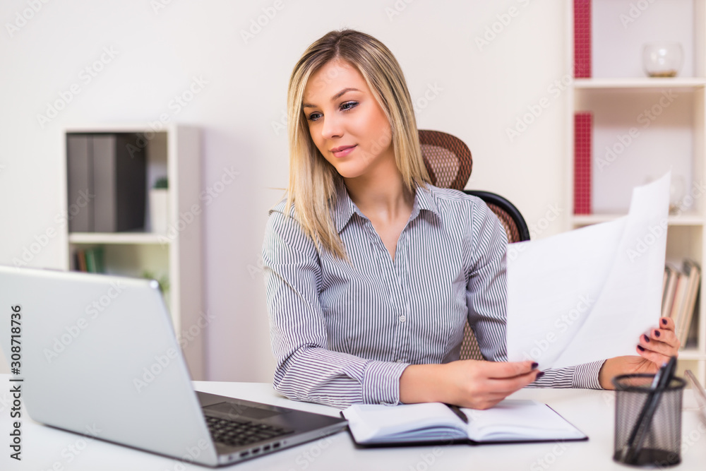Beautiful businesswoman working at her office. Beautiful businesswoman working at her office.
