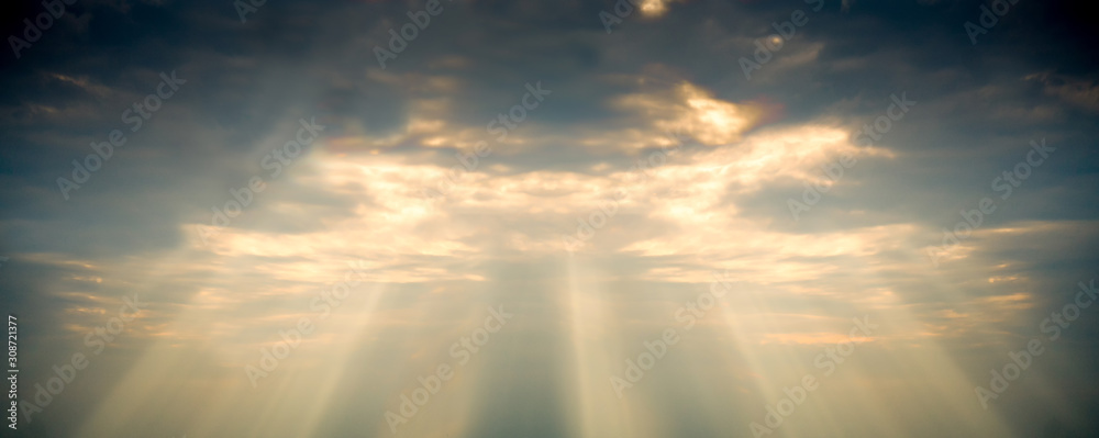 Fototapeta premium The golden god sun ray light through cloud