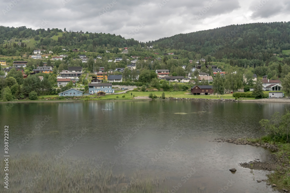 village on green lake shore, near Al, Norway