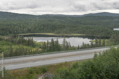 highway among lakes and woods, near Sokna, Norway