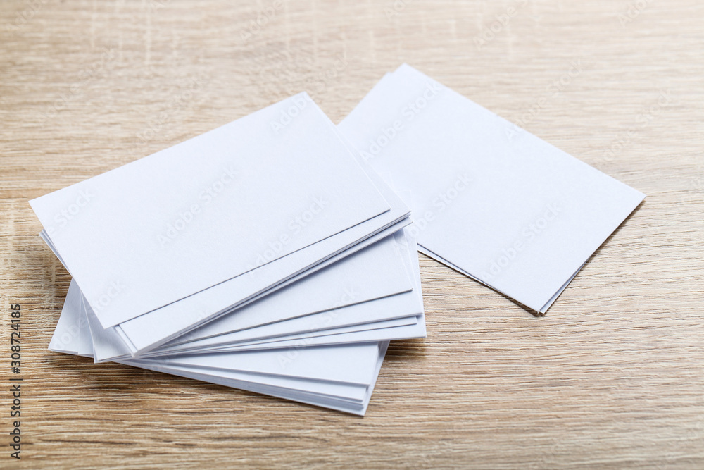 Blank business cards on brown wooden table Blank business cards on brown wooden table